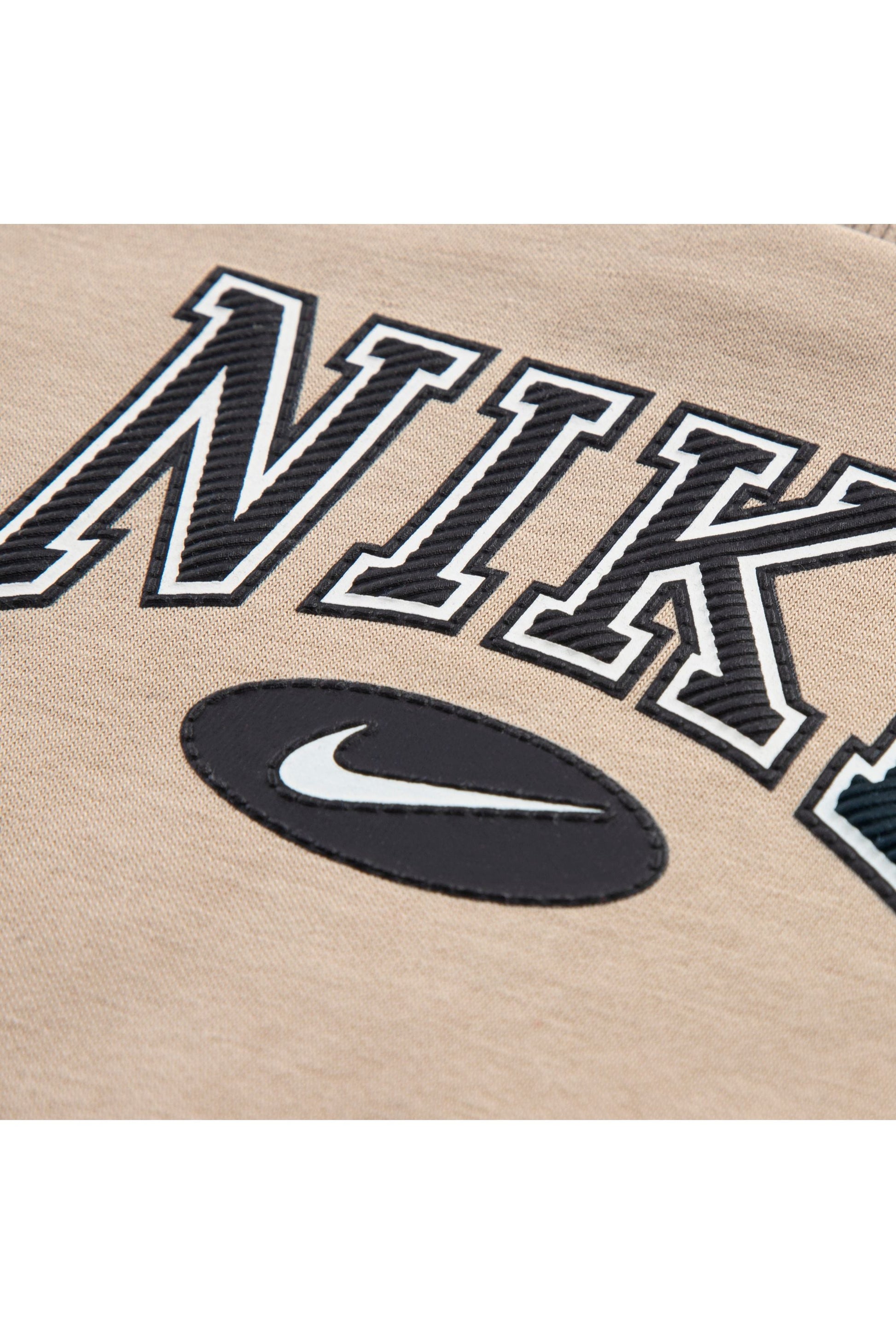 חליפת טרנינג NIKE עם פסי צד שחורים ולוגו קדמי לתינוקות BEIGE / 12M