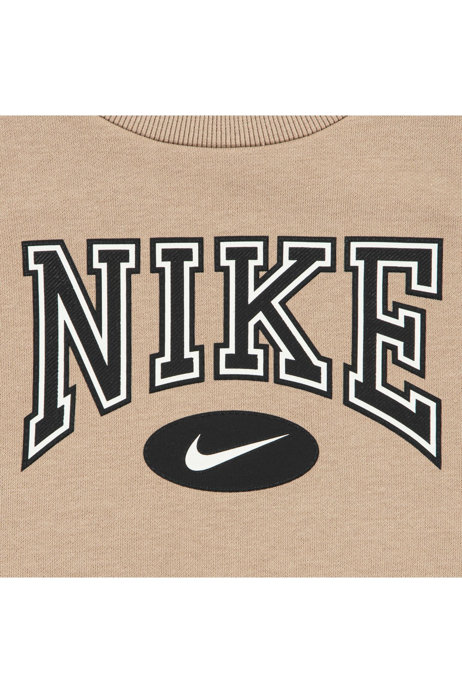 חליפת טרנינג NIKE עם פסי צד שחורים ולוגו קדמי לילדים BEIGE / 2Y